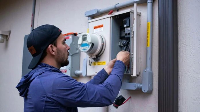 Technician performing residential HVAC maintenance